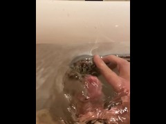 Legs open foreskin pulled back close up shower head masturbation