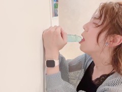 A very pretty and beautiful woman who performs fellatio with a dildo.