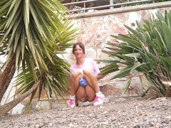 My girlfriend is peeing in the park