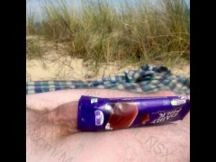 Nude beach fun - hung, horny and covering my big cock with a Cadbury’s ice cream wrapper