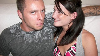 A slut with tattoos and brown hair gets turned on by a cock in her pussy