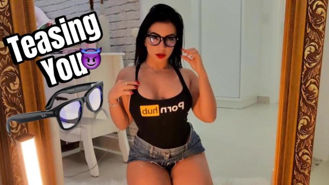 Sexy latina teasing in front of the mirror filming with her Ray Ban Meta Smart  glasses