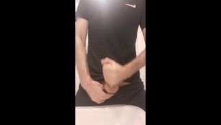 athletic skinny guy in sportswear jerking off in the gym, public toilet, public jerking off, hairy