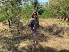Naughty wife plays with small tits in public park.