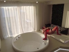 Marta jerks off her pussy with a huge dildo in an open window