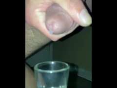 Drops of cum keep falling as I milk my cock into a glass- slo-mo