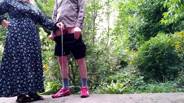 Sweet mother-in-law helps her son-in-law pee and pees while standing
