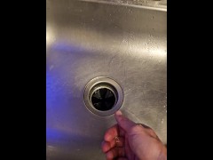 Messy piss into the kitchen sink