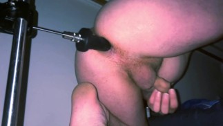 Two dildos on fuckmachine, ejaculating dildo