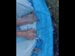 Letting fast water run across the top of my feet as I drain a pool
