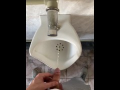 Guy pissing with big uncut cock in public toilet in slow motion POV