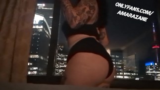 Showing Off in Toronto Hotel With Curtains Wide Open