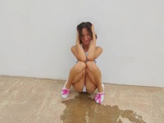 Sexy girl in a bodysuit pees