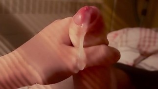 Precum and sperm leaking from a nice hard cock during a morning handjob