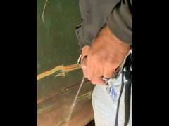 Guy pisses outside after jerking off, pee goes wild