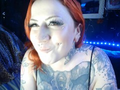 SAFE FOR WORK: Clothes Tattooed Redhead Chewing Bubblegum and Blowing Bubbles