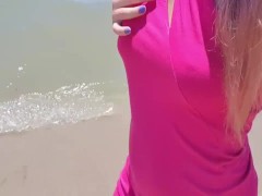 Blondy walkimg on sea and show pussy