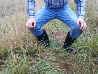 Rubber Boots Farmer Pee in his Pissy Pants and Plays with his Cock on the Meadow