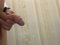 Uncut cock with big balls pissing at friends toilet
