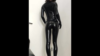 Femboy showing and polishing his black shiny latex catsuit