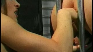 Babe with long hair peggs a prisoner in her prison cell