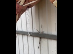 Milf in boots pees at the fence