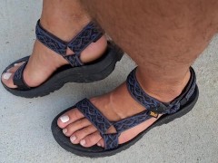 My male pedicured feet in sandals
