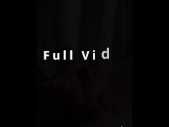 My slave lies on the floor, I crush his balls and cock with my foot
