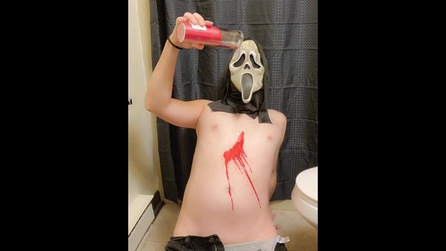 Halloween Ghostface pours hot red wax all over