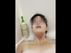 Girl masturbates in bathtub with her fingers and brings herself to orgasm