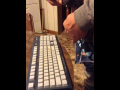 Masturbating until I shoot my load on a computer keyboard