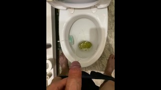 Morning pissing in the toilet with an uncircumcised penis, view from the eyes