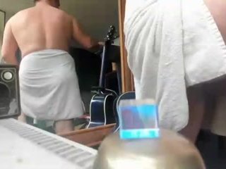 nude male on webcam with a towel