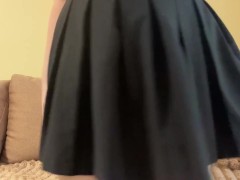 Attractive brunette shows what's under her skirt.