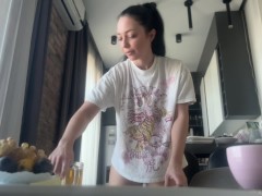 Sexy fit brunette does housework without panties.