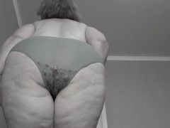 A mature fat milf with big natural saggy tits tries on panties.