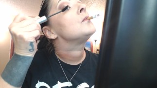 Doing Make up Dangling a Cigarette Cork Full Flavor