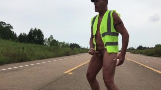 Construction worker in middle of road naked and jacking off.  Eats own cum.