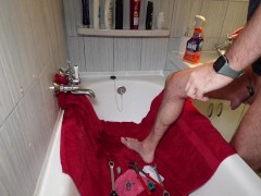 Repairing a faucet while naked wearing a penis ring.