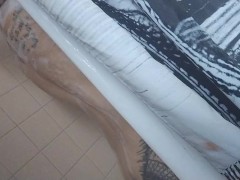 Behind The shower Curtain