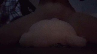 Teen humping teddy bear while watching TV.