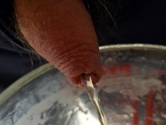 Pissing in a yoghurt mixing glass