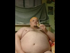 Fat hairy guy gets excited eating donuts