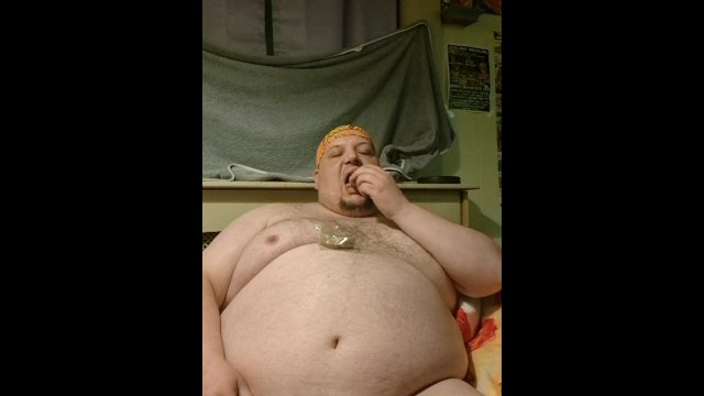 Fat hairy guy gets excited eating donuts