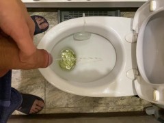 Guy pees uncut dick in toilet