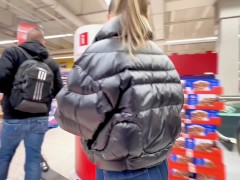 I'm walking around the supermarket in a shiny down jacket with bare tits