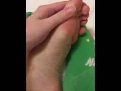 Foot fetish. Girl shows her perfect feet close-up, takes off her socks