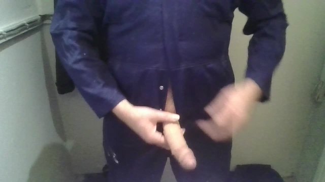 Wanking and spunking my big cock wearing a mates boilersuit at work