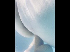 Stunning MILF fucks herself under water