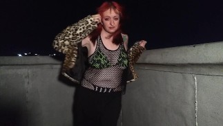 Goth girl models on rooftop at night in bikini